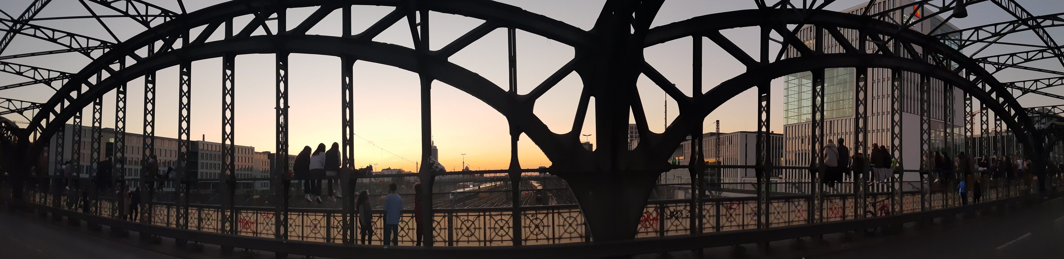 panorama of sunset viewers at Hackerbruecke